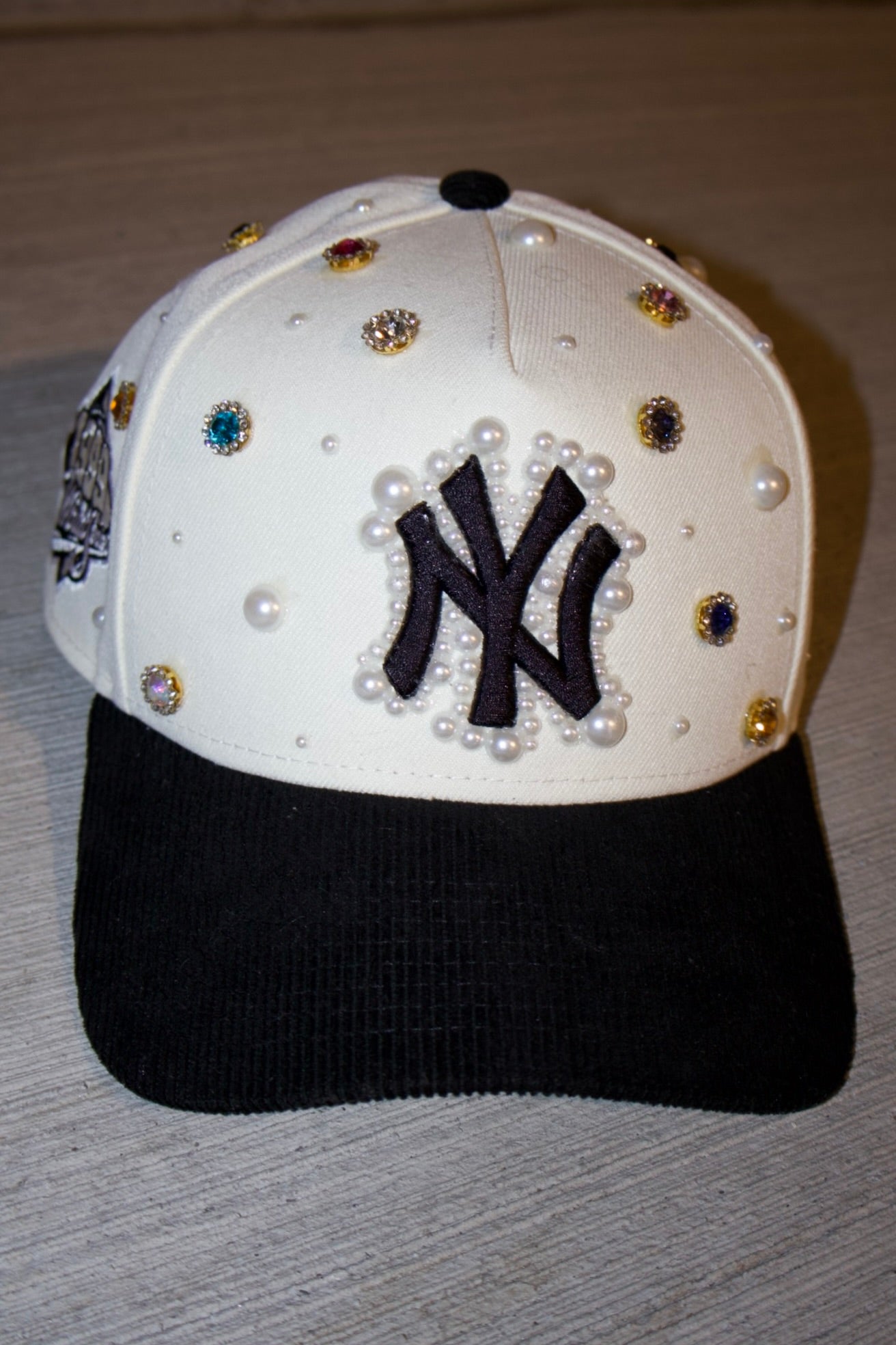 the "GEMS N PEARLS" hat