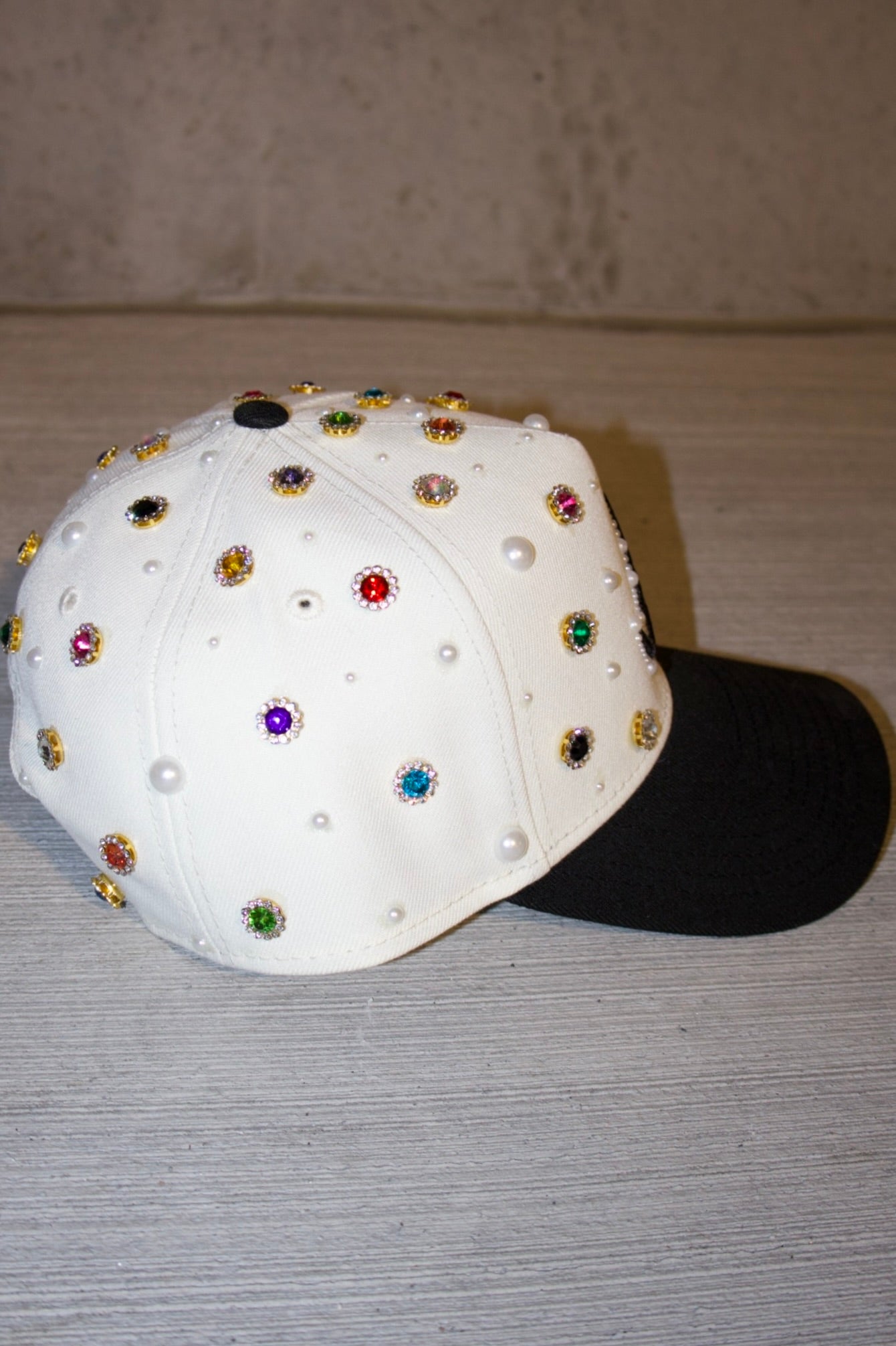 the "GEMS N PEARLS" hat